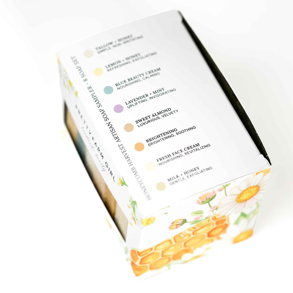 Honeycomb Harvest 8-piece goat milk and tallow soap sampler kit featuring essential oil scents and floral packaging.